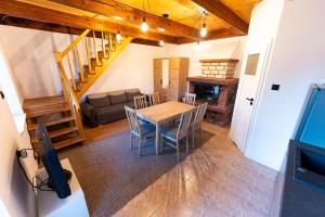 a living room with a table and chairs and a couch at FULEDA Holiday Home in Fuleda