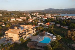 an aerial view of a house with a swimming pool at Tsokas Hotel in Finikounta