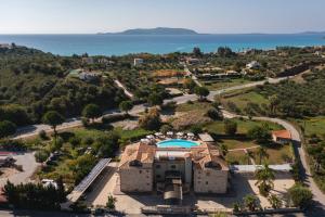 an aerial view of a resort with the ocean in the background at Tsokas Hotel in Finikounta
