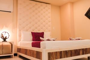 Voodi või voodid majutusasutuse Hotel Plaza Garibaldi toas