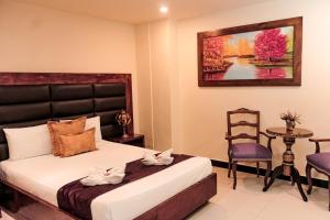 Voodi või voodid majutusasutuse Hotel Plaza Garibaldi toas
