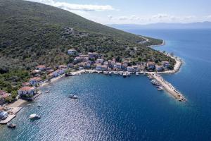 an aerial view of a small island in the water at Seagull House 3 in Ayía Kiriakí +22 photos