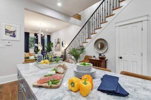 a kitchen with a table with food on it at Designer Home Walking Distance To The French Quarter's in New Orleans