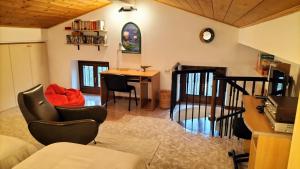 a living room with a table and chairs at Casa Il Volo in San Zeno di Montagna