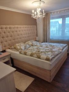 Ένα ή περισσότερα κρεβάτια σε δωμάτιο στο Whirlpool Appartement Baden-Baden, Schwarzwald