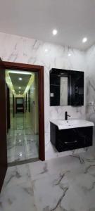 a large bathroom with a sink and a mirror at Villa mima in Houmt Souk