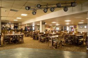a restaurant with tables and chairs in a room at Whitstable Vacation in Kent
