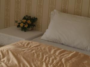 Postel nebo postele na pokoji v ubytování Chomdao Hotel