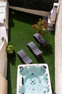 an aerial view of a patio with two chairs and a table at Luma Retreat Jacuzzi & Peaceful Rides in Petrača