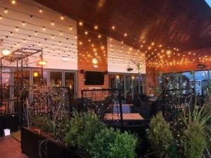 a restaurant with lights and plants in a building at 8 Berth Static Caravan in Patrington