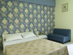 Postel nebo postele na pokoji v ubytování Chomdao Hotel