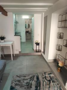 a hallway of a room with a living room at Maison M in Portimão +22 photos