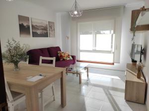 Μια τηλεόραση ή/και κέντρο ψυχαγωγίας στο Apartamento 1 habitacion 450m playa Baltar-VUT