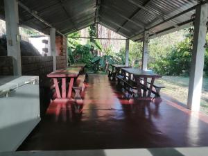 a group of picnic tables in a pavilion at Hotel Bellavista Isla del Sol in Prado