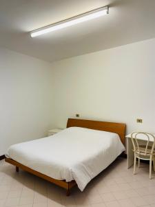 Postel nebo postele na pokoji v ubytování Apparthotel Oleggio