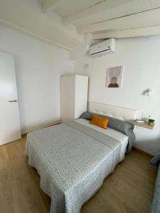 Een bed of bedden in een kamer bij Casa del Portillete