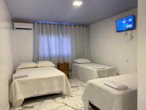 Postel nebo postele na pokoji v ubytování Hotel WM