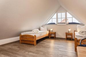 En eller flere senger på et rom på 50030 Ferienwohnung Nordwind