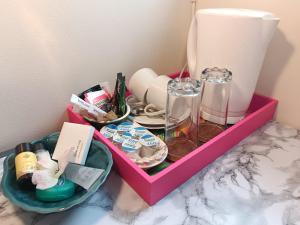 a pink tray with a bunch of items on a counter at Bernie's Place - Homestay in Castlebar