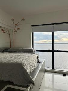 Postel nebo postele na pokoji v ubytování Tropical Executive Hotel N 925