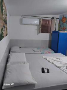 Tempat tidur dalam kamar di Pousada Porto Marola