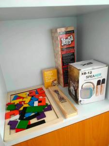 a table with a box of lego and a box of a box at Condo At Azure North San Fernado in San Fernando