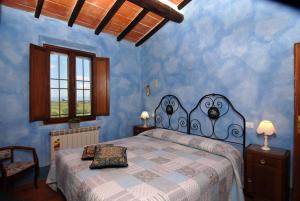 A bed or beds in a room at Tenuta Santagnese