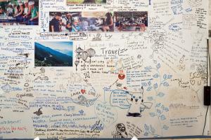 a refrigerator covered in writing and pictures and drawings at Hoi An Love.Ly Hostel in Hoi An