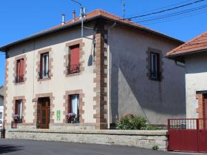 a building with red shutters on the side of it at Gîte Parroy, 4 pièces, 6 personnes - FR-1-584-29 