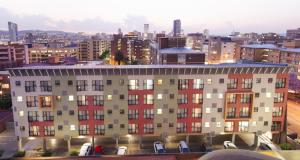 a view of a building with a city in the background at Akanani Apartments in Pretoria