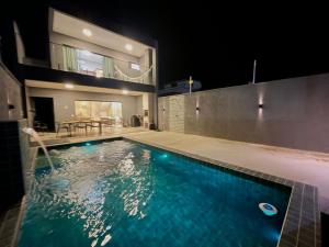 a swimming pool in the middle of a house at Casa Sofia Milagres - 200 m da Praia in São Miguel dos Milagres