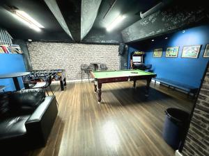 a living room with a pool table in it at Europa Melbourne in Melbourne