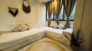 Postel nebo postele na pokoji v ubytování Hotel Noah Tulum