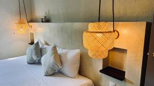 Postel nebo postele na pokoji v ubytování Hotel Noah Tulum