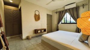 Postel nebo postele na pokoji v ubytování Hotel Noah Tulum