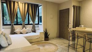 Postel nebo postele na pokoji v ubytování Hotel Noah Tulum
