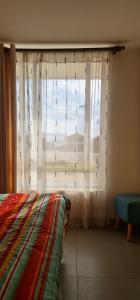 En eller flere senge i et værelse på Laguna del mar La Serena Piso 1