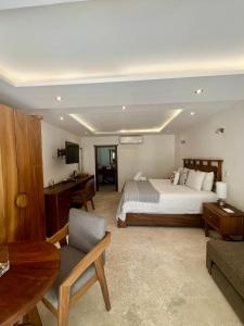 Postel nebo postele na pokoji v ubytování El Paraiso Hotel Tulum