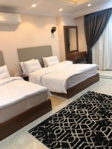 Ein Bett oder Betten in einem Zimmer der Unterkunft Aziz Egypt Pyramids View