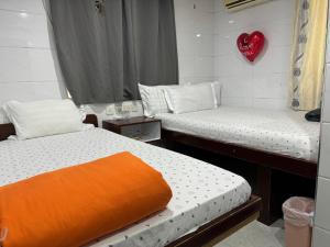 Voodi või voodid majutusasutuse Relaince lucky MIRADOR MANSION toas