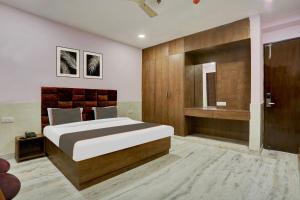 Cama o camas de una habitación en OYO Flagship Shivaay Residency