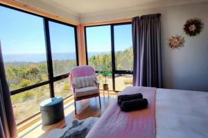 Ένα ή περισσότερα κρεβάτια σε δωμάτιο στο Black Wattle Coastal Retreat