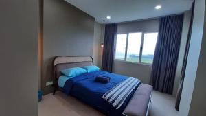 Postel nebo postele na pokoji v ubytování Santubong Suites A Just Like Home Damai
