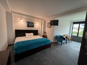 Postel nebo postele na pokoji v ubytování Royal Rest Imbabura