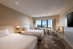 Vuode tai vuoteita majoituspaikassa Hilton Darwin
