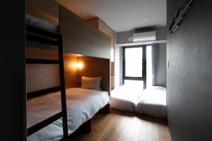 Postel nebo postele na pokoji v ubytování Grids Tokyo Ueno Hotel&Hostel