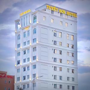 a white building with a hotel sign on it at Tuyet Son Hotel (TS Ocean Hotel) in Da Nang