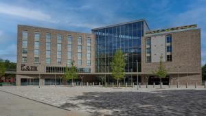 a large building with a lot of windows at voco Leicester, an IHG Hotel in Leicester
