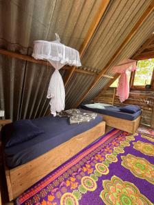 Postel nebo postele na pokoji v ubytování Backpackers Hostel
