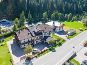 an aerial view of a large house with a driveway at Chalet in Saalbach near Ski Lift in Saalbach-Hinterglemm